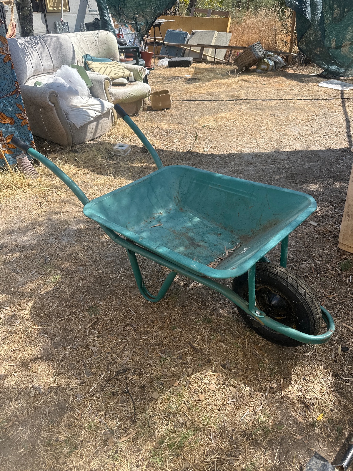 Used Green Metal Wheelbarrow — 1